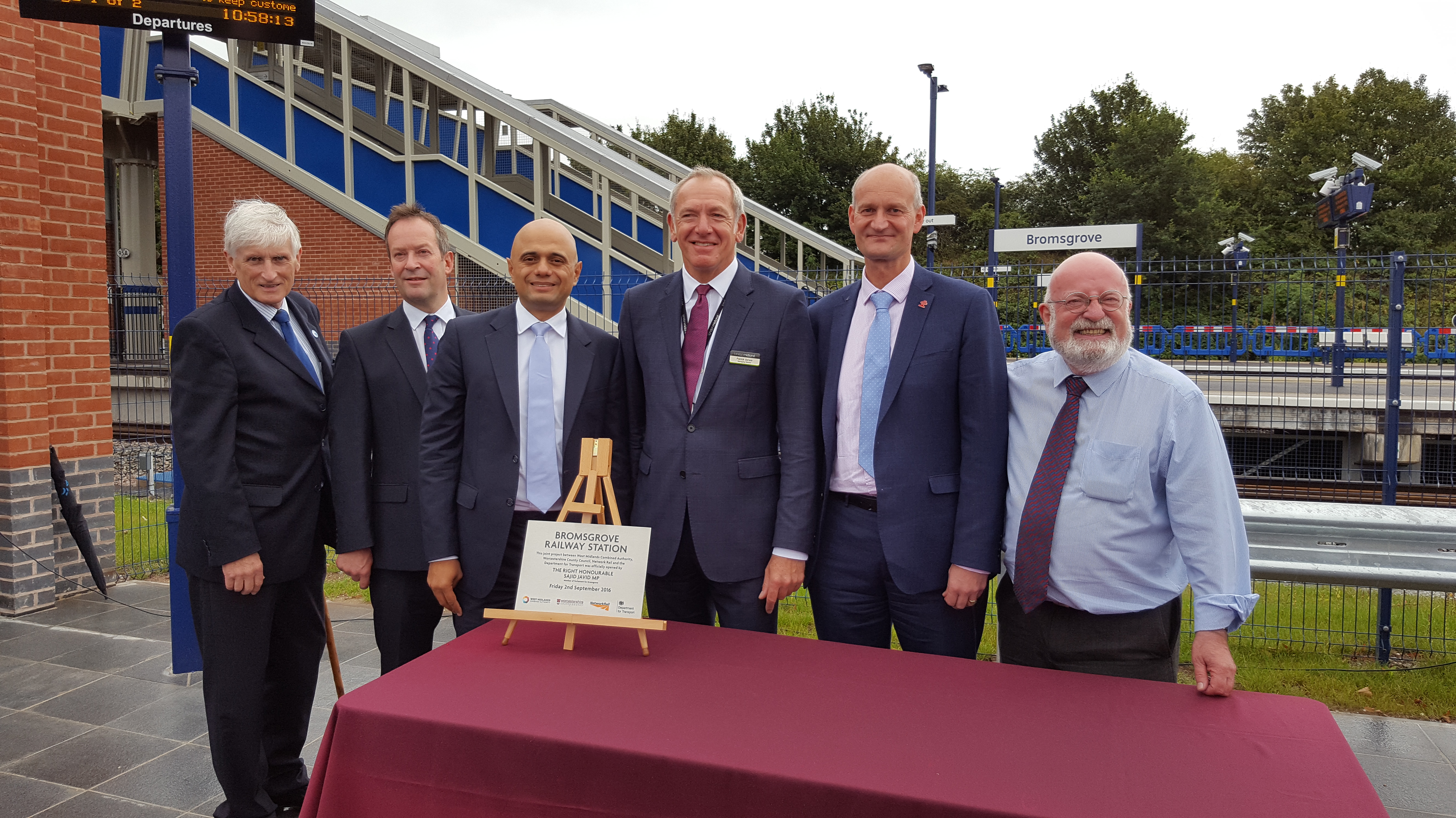 Cllr Ken Pollock, left, Richard Dugdale, Sajid Javid MP, Patrick Verwer, James Aspinall, WMCA director of corporate services, and Cllr Richard Worrall mark the official opening of Bromsgrove station.