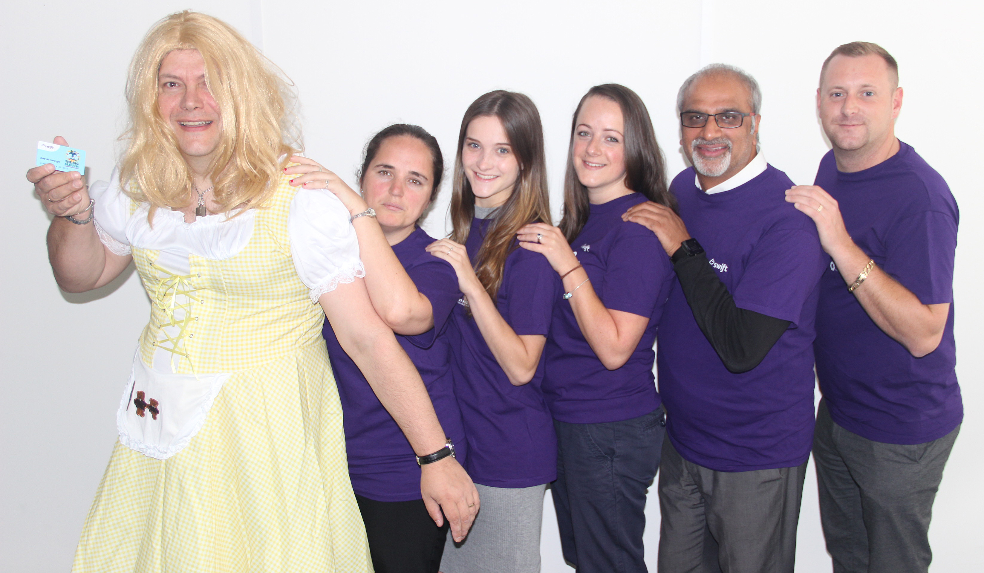 Michael Wevill as Goldilocks holds a Big Sleuth Swift card with team members Julie Lakin, left, Sophie Lewis, Laura Anderson, Pankaj Patel and Andy Purchase.