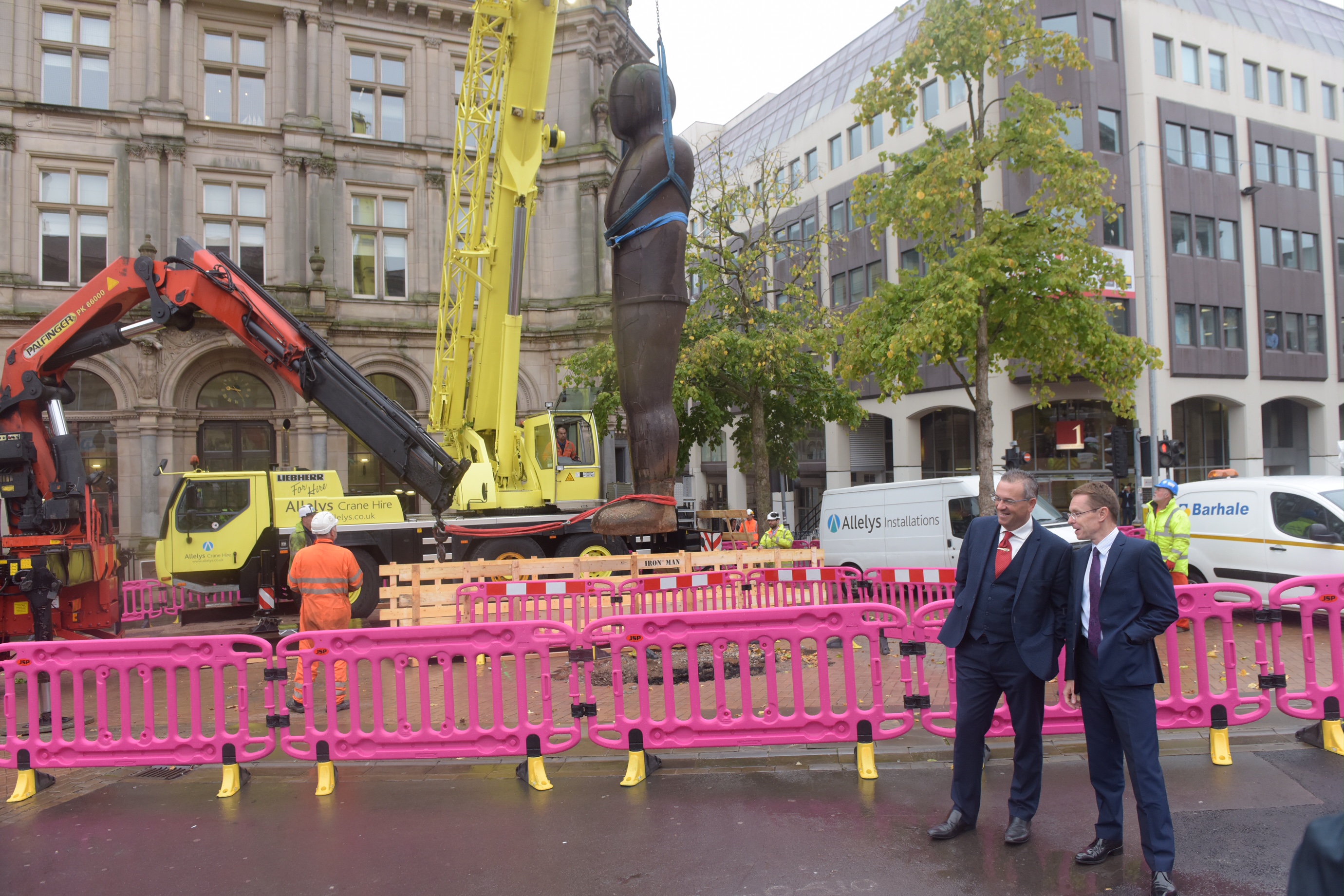 Lift Off: Mayor for the West Midlands Andy Street and Cllr John Clancy, leader of Birmingham City Council, oversee the raising of the Iron; Man statue as work on the next expansion of the Midland Metro is officially launched.