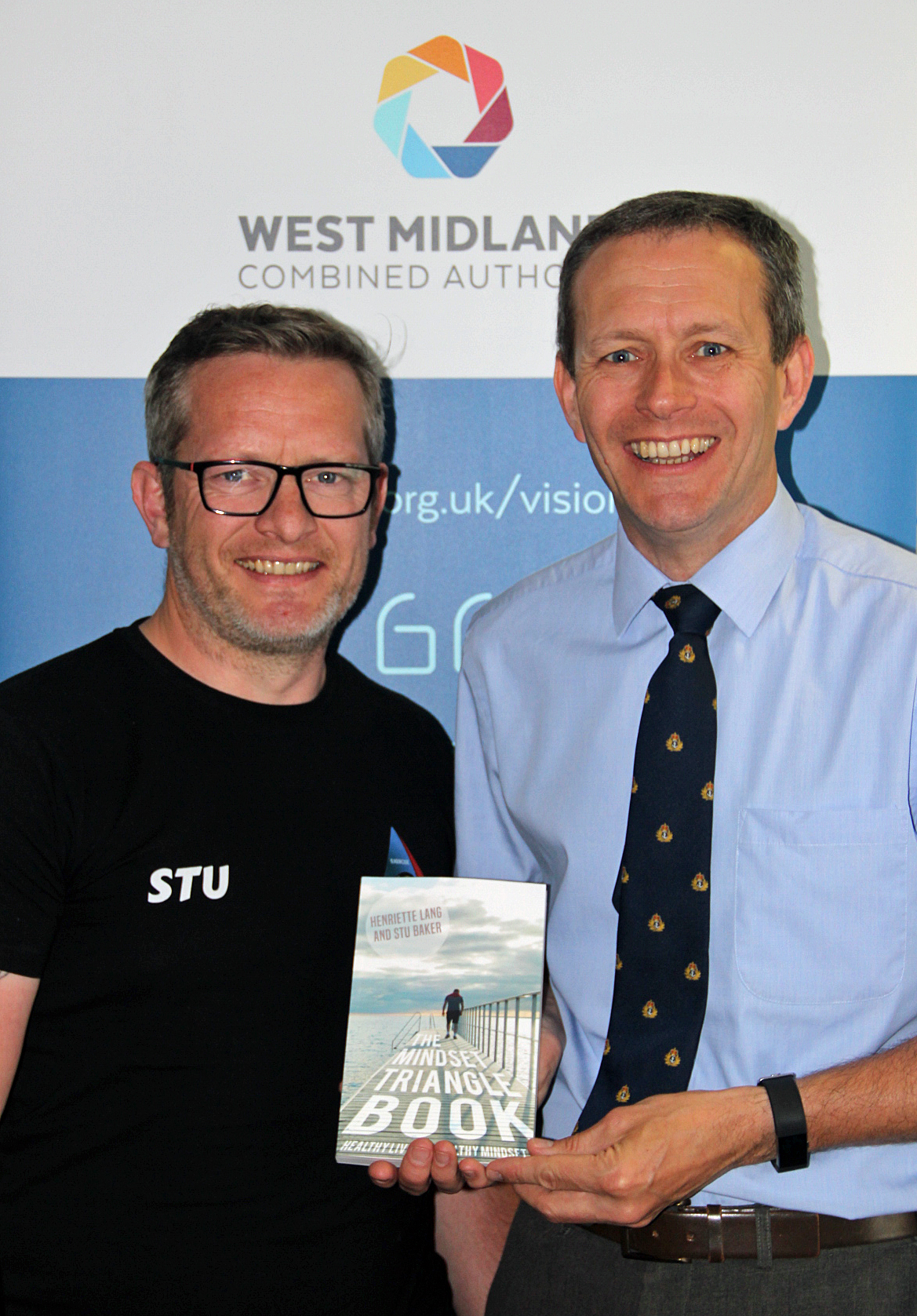 Stu Bagsy signed a copy of his newly published book for Thrive West Midlands implementation director Sean Russell.