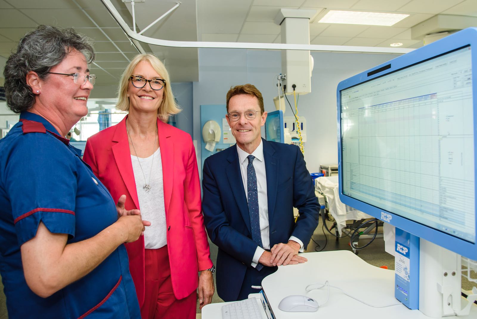 Helen Gyves (left), lead nurse for Clinical IT at Birmingham's Queen Elizabeth Hospital explains to Minister for Digital, Margot James and Mayor of the West Midlands Andy Street how 5G technology will enable outpatient appointments to be carried out remotely