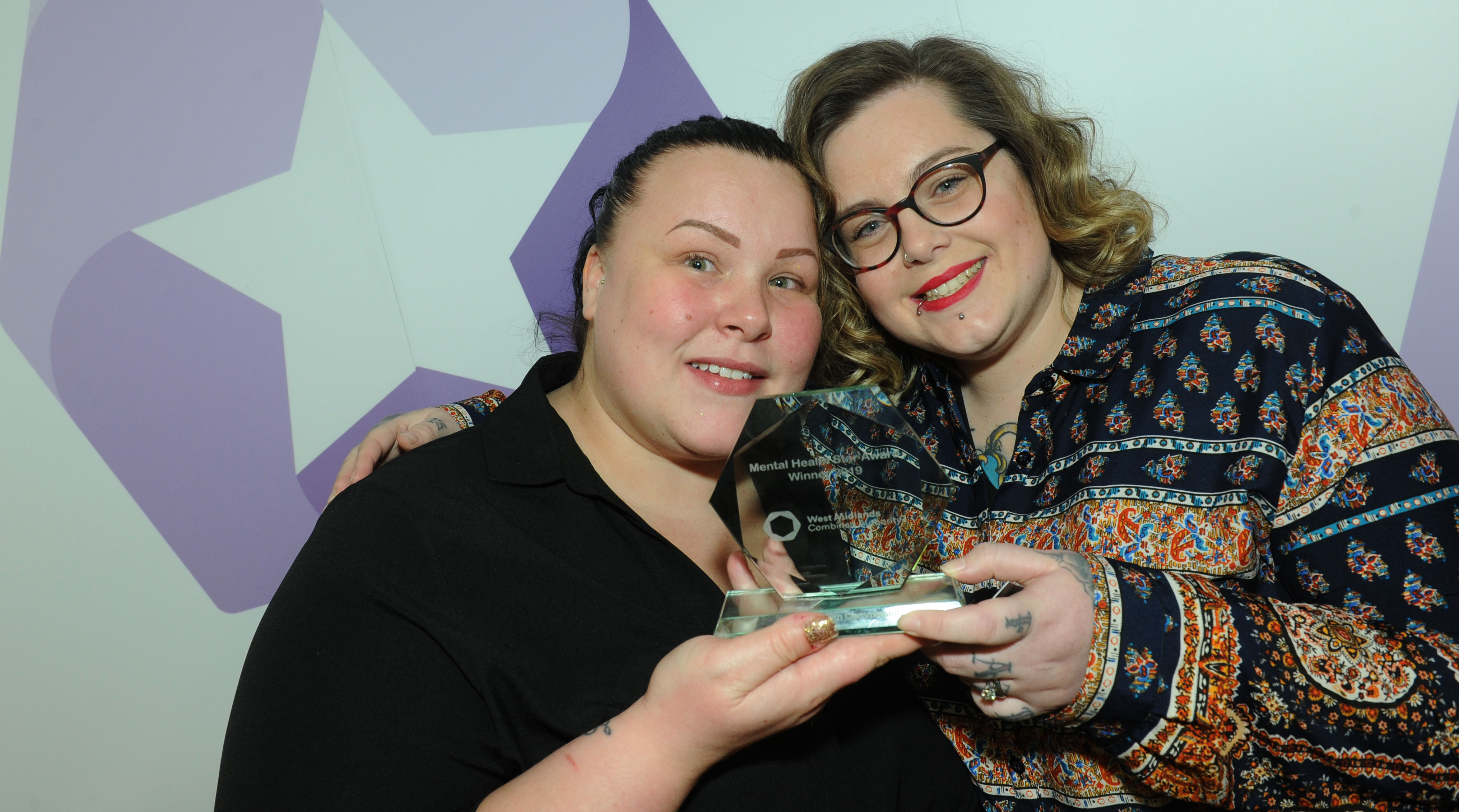 Laura Fogarty (left) and Laura Gee with their award