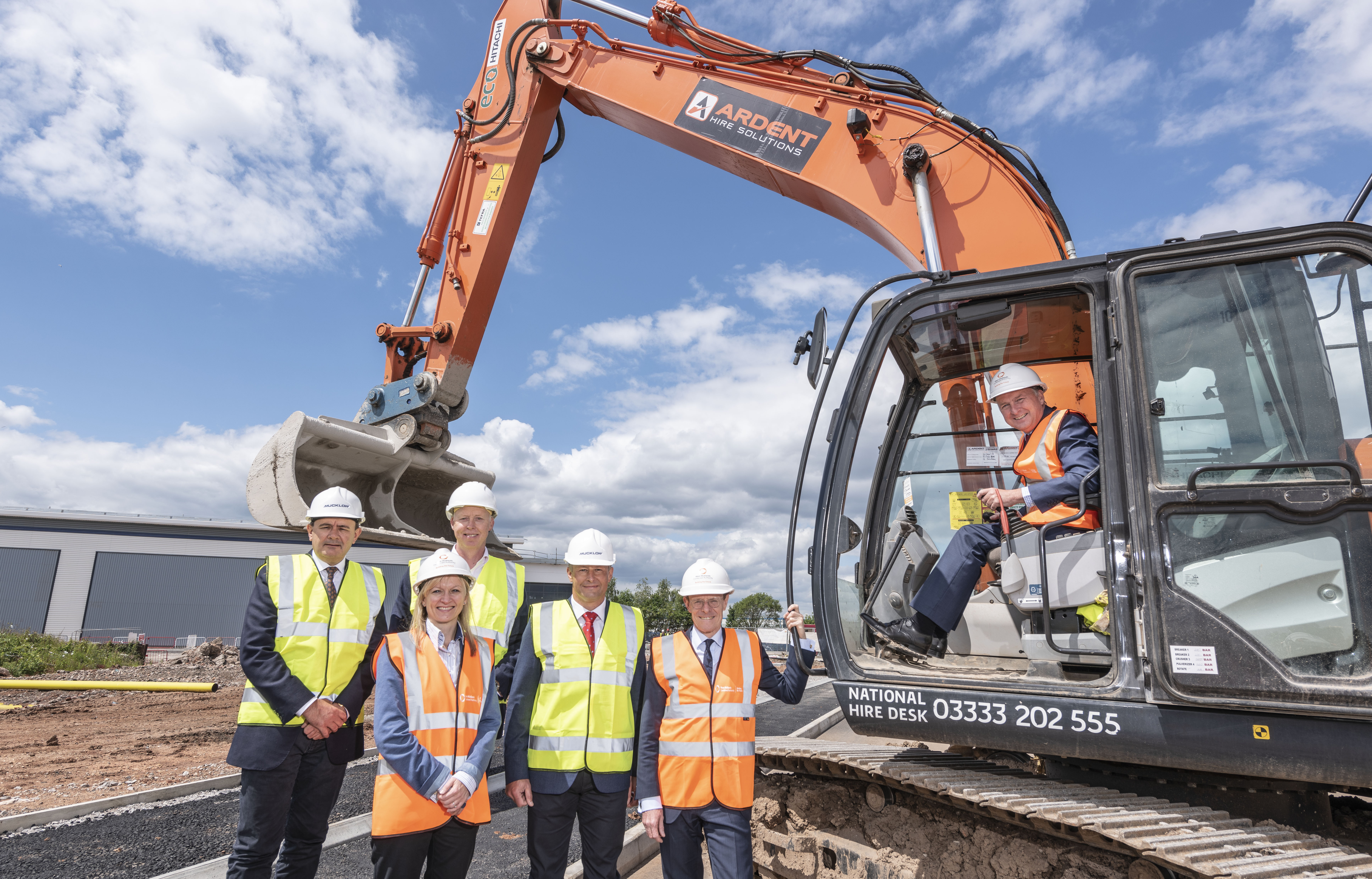 The redevelopment of the historic Joseph Lucas car battery plant in Birmingham is one of the schemes benefiting from WMCA funding; From left: Nick Heath (Mucklow), Katie Trout (GBSLEP), Nick Oakley (Frontier Development Capital), Mark Vernon (Mucklow), Mayor Andy Street and in the cab Cllr Ian Ward, leader of Birmingham City Council