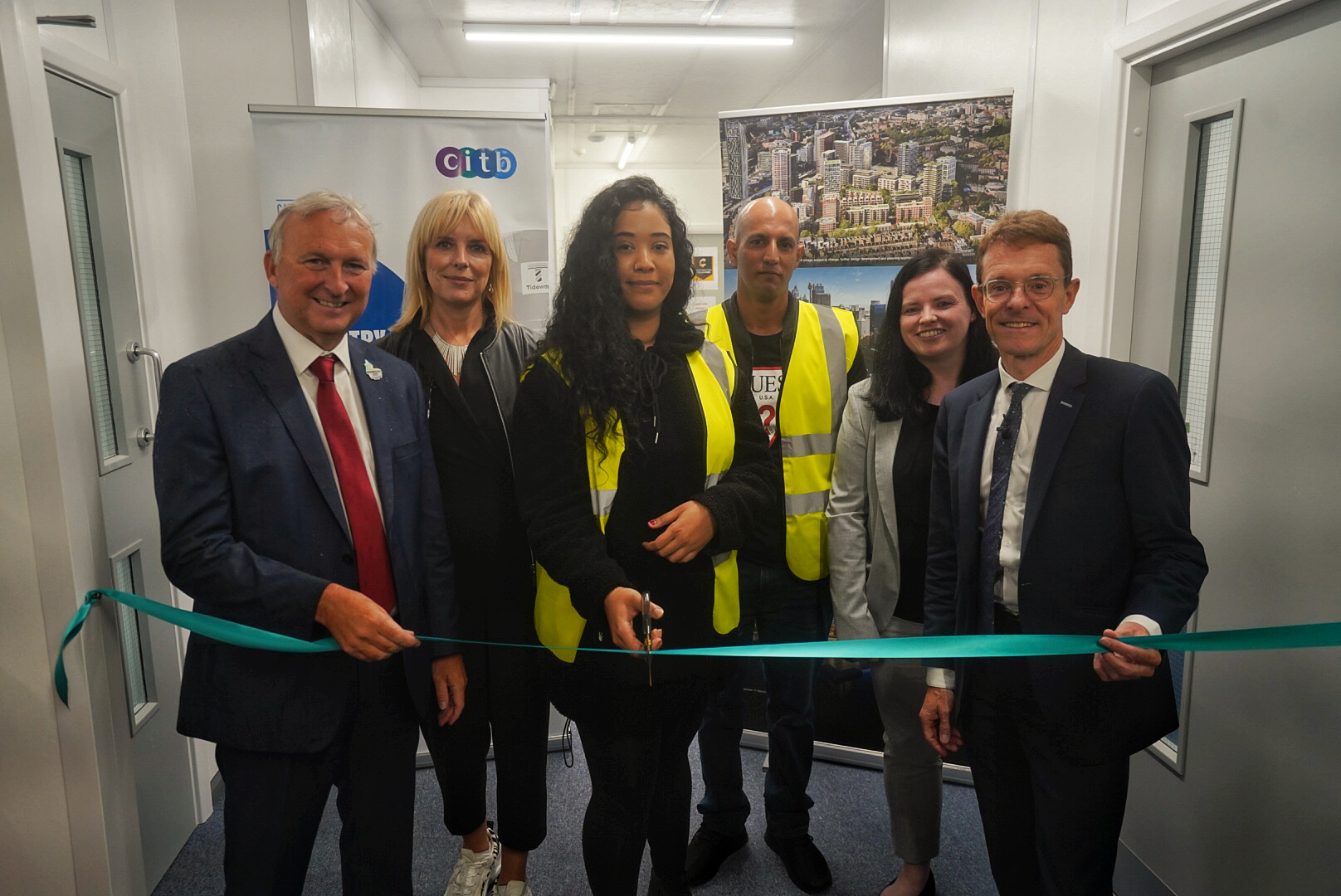 (from left) Cllr Ian Ward, leader of Birmingham City Council, Anna Evans, project director for the Perry Barr Residential Scheme at developers Lendlease, trainees Imaan Khan and Zubar Akram, Sarah Fenton from CITB, and Mayor of the West Midlands Andy Street officially cut the ribbon to open the construction training hub at the Perry Barr Residential Scheme.