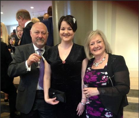 Cariss Evans is pictured in the centre, celebrating winning The Brain Tumour Charity’s Volunteer of the Year Award 2018, with her parents John and Elizabeth