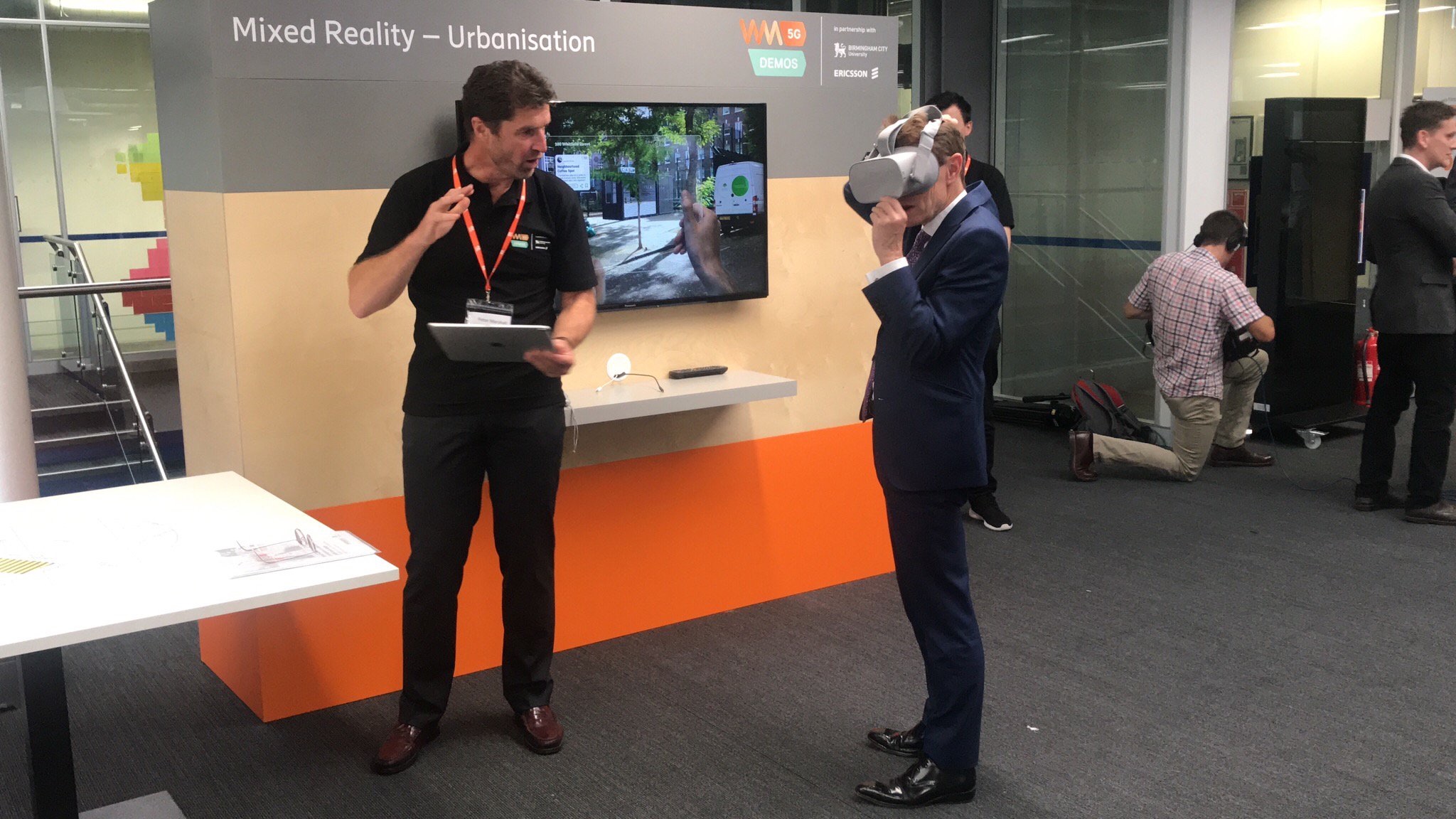 Mayor of the West Midlands Andy Street (right) experiences a virtual reality application as part of the 5G demonstration