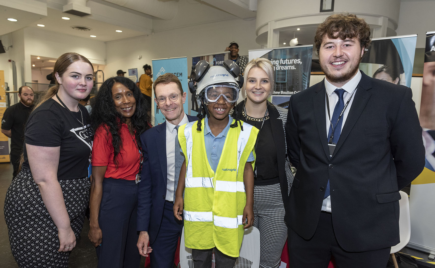Six-year-old Kavalli Hemmings from Hockley with Mayor Andy Street (centre) and exhibitors at the careers roadshow at the  Legacy Centre of Excellence (LCoE), formerly The Drum, in Aston