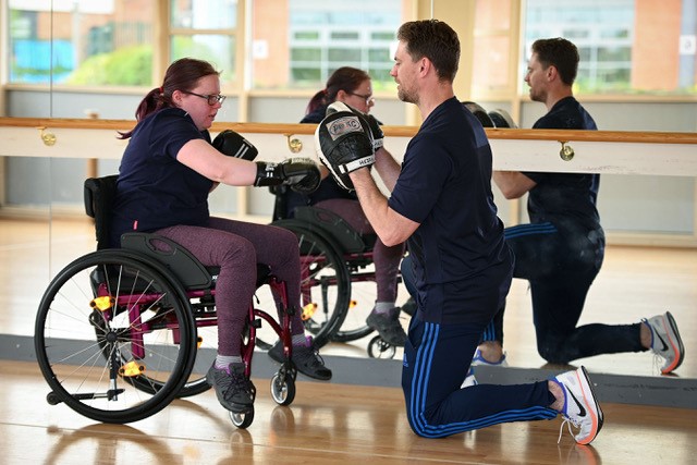 Warley Boxing Club coach Richard Heritage instructs Wendy Hurst, who is now an England Boxing Level 1 coach, at the first Accessible Games.