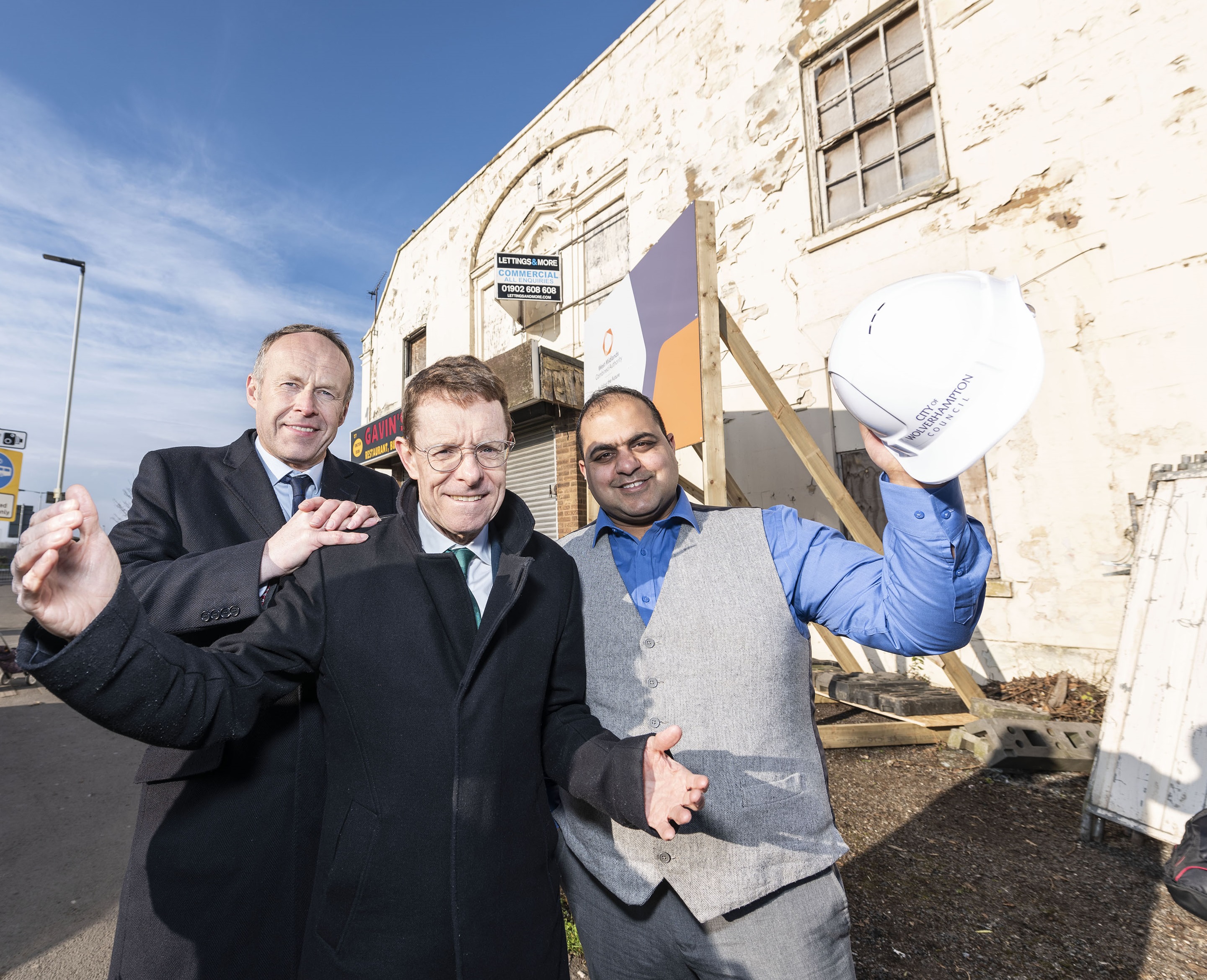 From left: Jon Bramwell, chair of the Regional Town Centre Taskforce and a managing director at HSBC Commercial Banking, Mayor of the West Midlands Andy Street and Cllr Harman Banger, cabinet member for city economy at City of Wolverhampton Council outside the derelict Pipe Hall