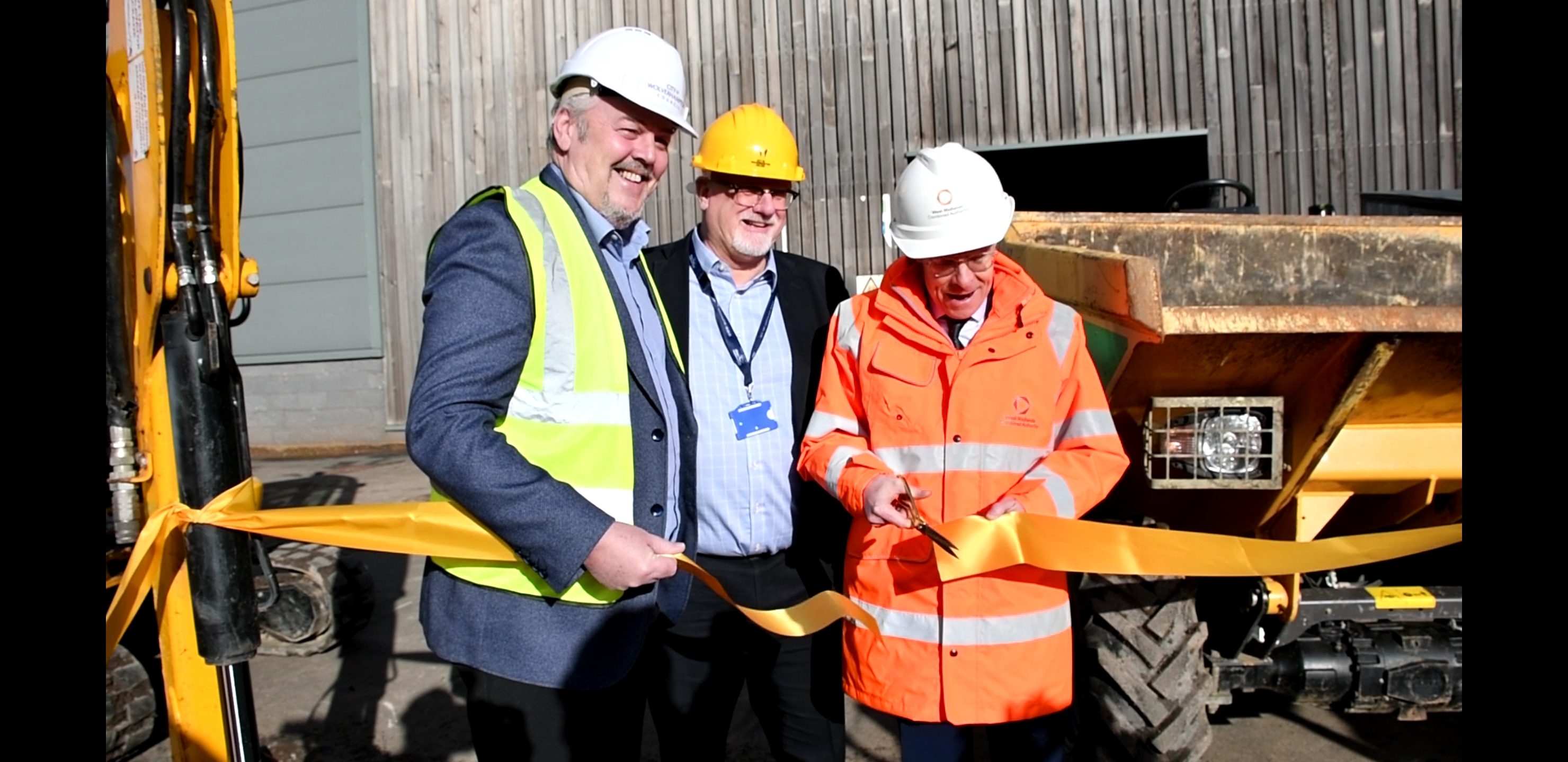 L-R Cllr Ian Brookfield, leader of City of Wolverhampton Council, Malcolm Cowgill, principal and chief executive at City of Wolverhampton College, and Mayor of the West Midlands Andy Street cutting the ribbon at the new construction plant training centre