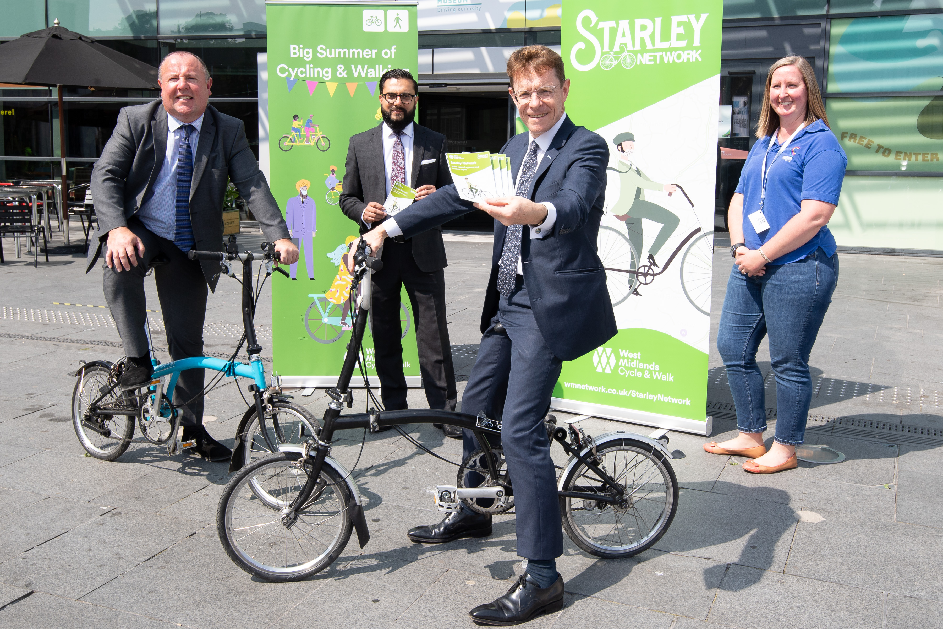 L-R Cllr Jim O'Boyle, Coventry City Council cabinet member for jobs and regeneration, Sandeep Shingadia, TfWM's director of development and delivery, Mayor of the West Midlands Andy Street and Megan Nass, curator of cycles and transport objects at Coventry Transport Museum