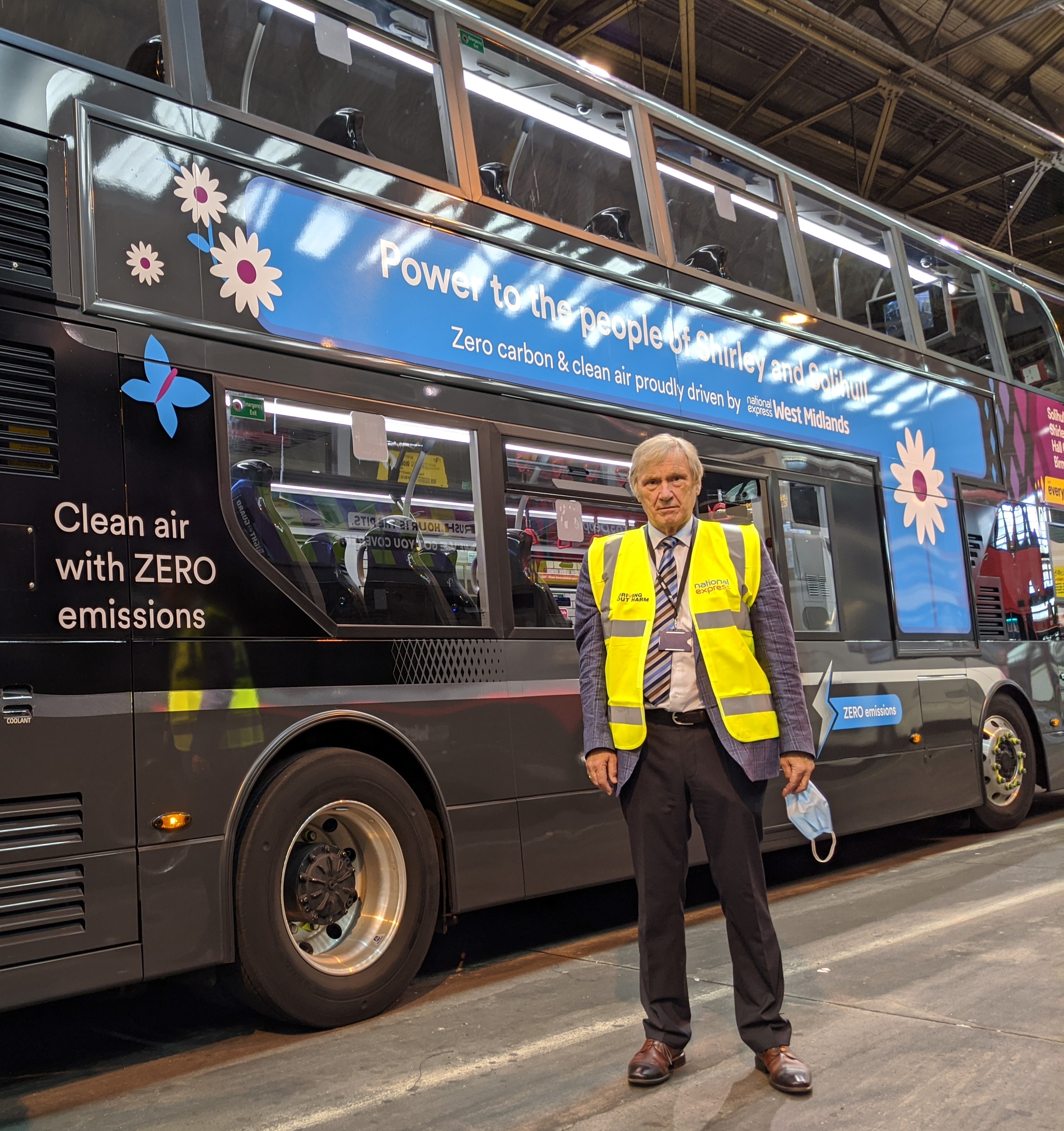 Cllr Ian Courts, WMCA portfolio lead for environment and energy, and leader of Solihull Metropolitan Brough Council in front of one of the green buses that serves Solihull
