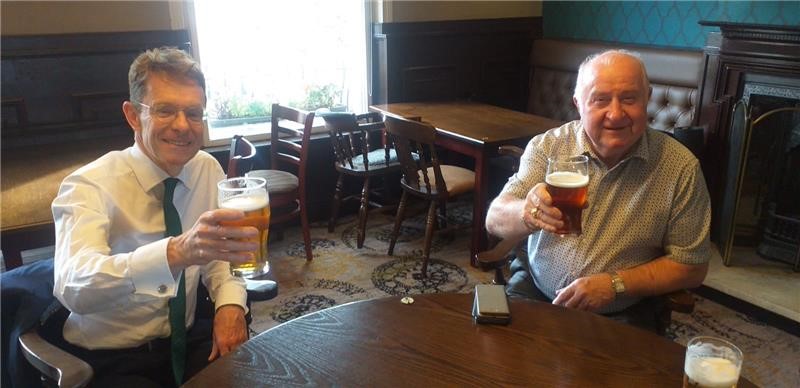 Cheers! Andy Street, Mayor of the West Midlands (left) and Cllr Mike Bird, leader of Walsall Council enjoying a pre-lockdown pint. The WMCA funding will help communities save their local pub from possible closure