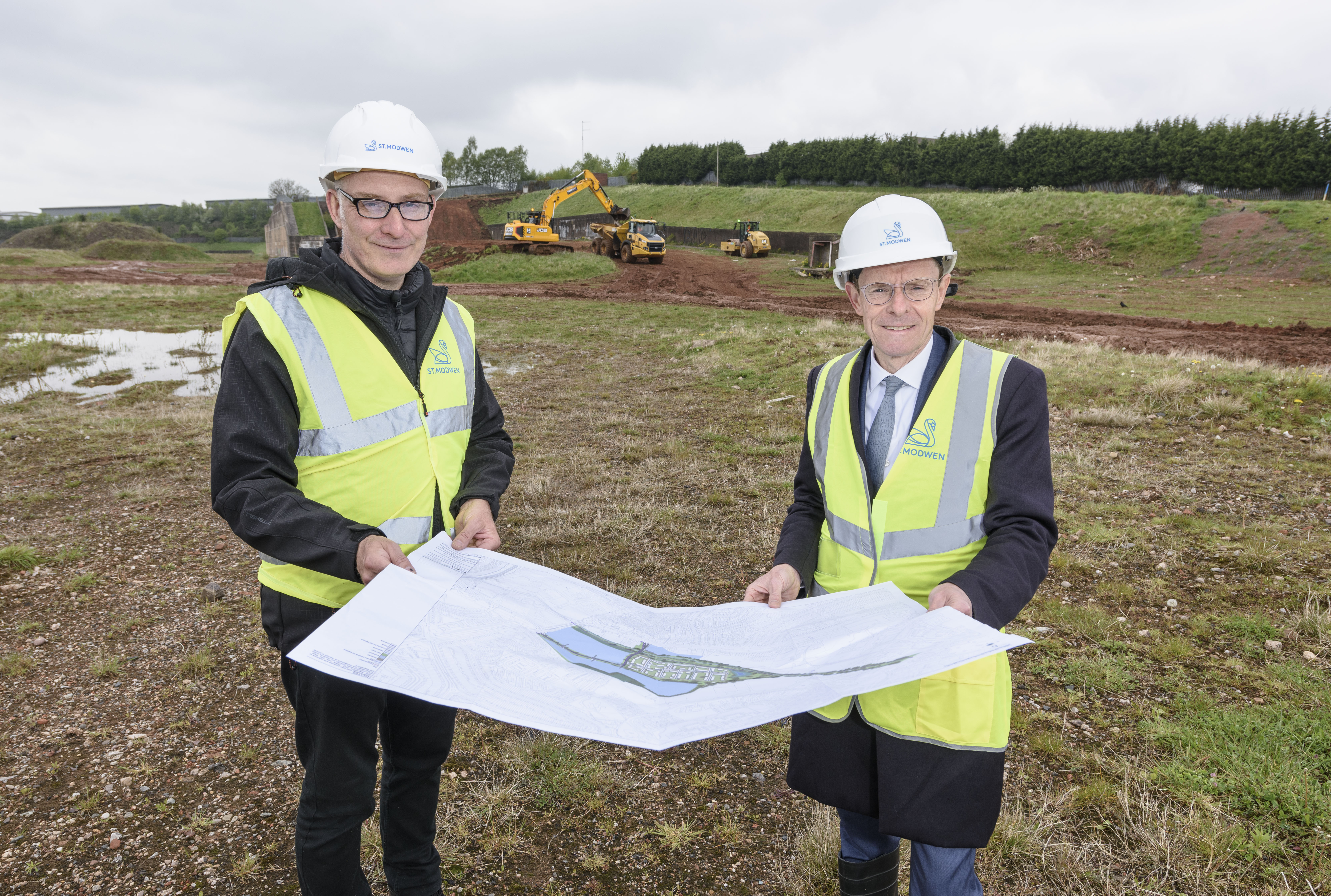 Rob Flavell, St Modwen's senior director for regeneration in the Midlands and North (left) and Andy Street, Mayor of the West Midlands (right) at the former West Works site in West Longbridge