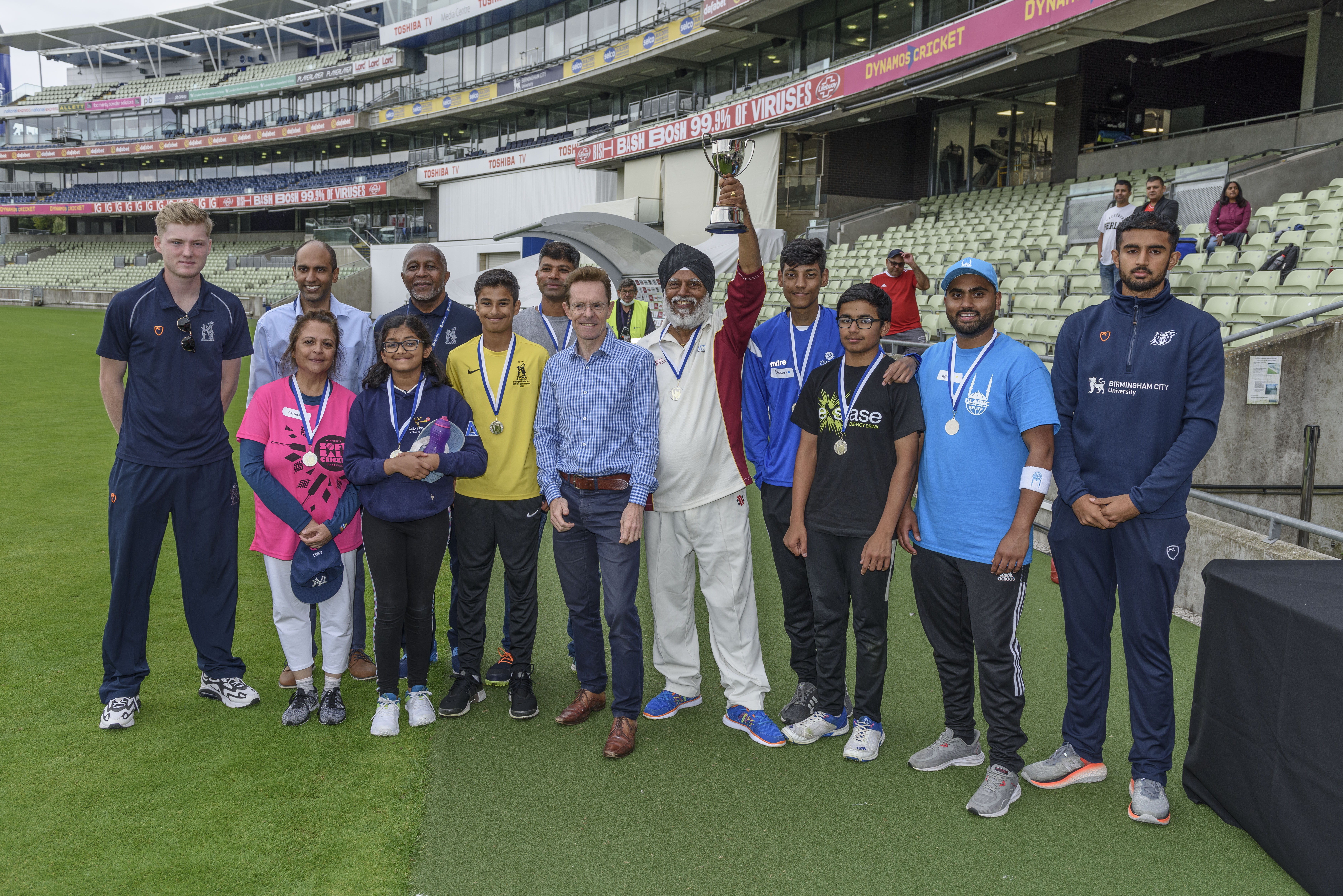 Dan Mousely (WCCA batsman), Ravi Masih (WCCC), Anjana Shelat (winning team), Deepak Chimania (winning team), Andy Street, Terlocan Singh (Captain winning team), Adbul Hannan (winning team), Manraj Johal (WCCC bowler) with younger members of the winning team