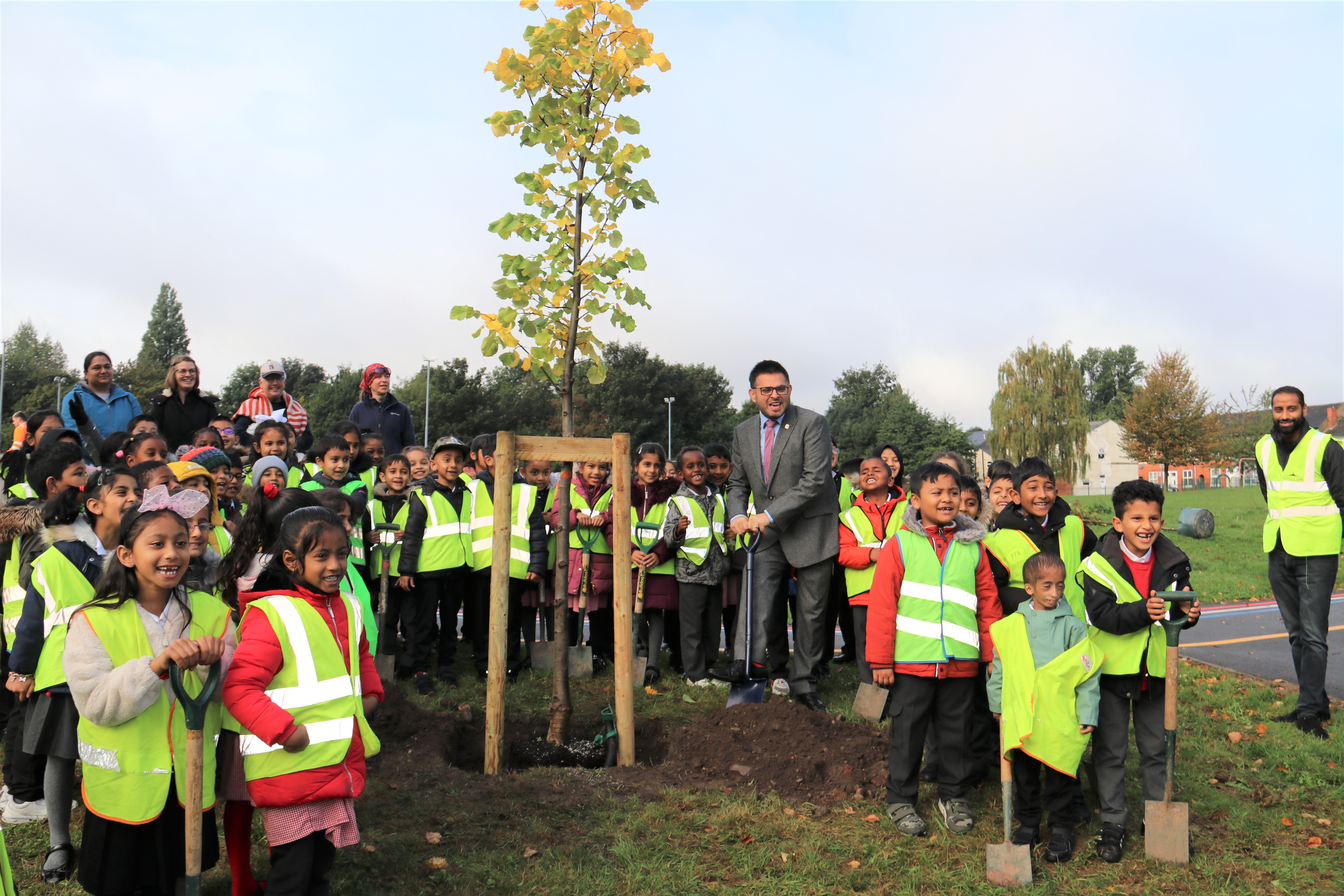 Cllr Waseem Zaffar joins pupils from Anglesey Primary School in Lozells to plant trees in Georges Park