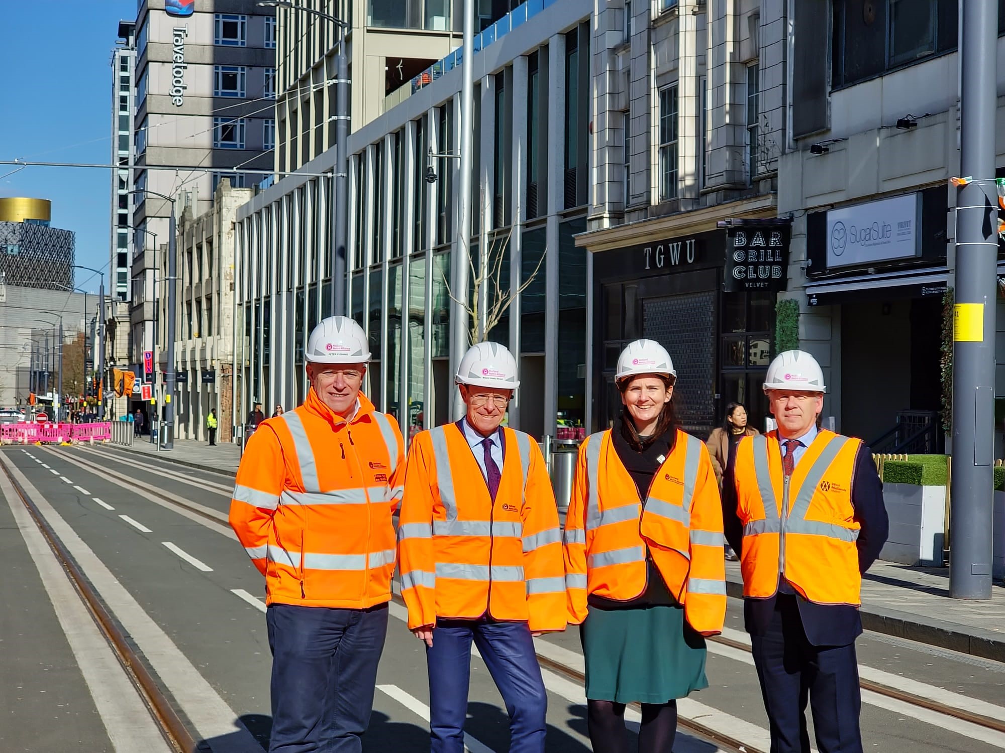 From left, Peter Cushing, director of Midland Metro Alliance; Andy Street, Mayor of the West Midlands; Cllr Brigid Jones, WMCA portfolio holder for inclusive communities and deputy leader of Birmingham City Council with Michael Anderson, West Midlands Metro projects director, celebrating the Metro construction entering its final stages.