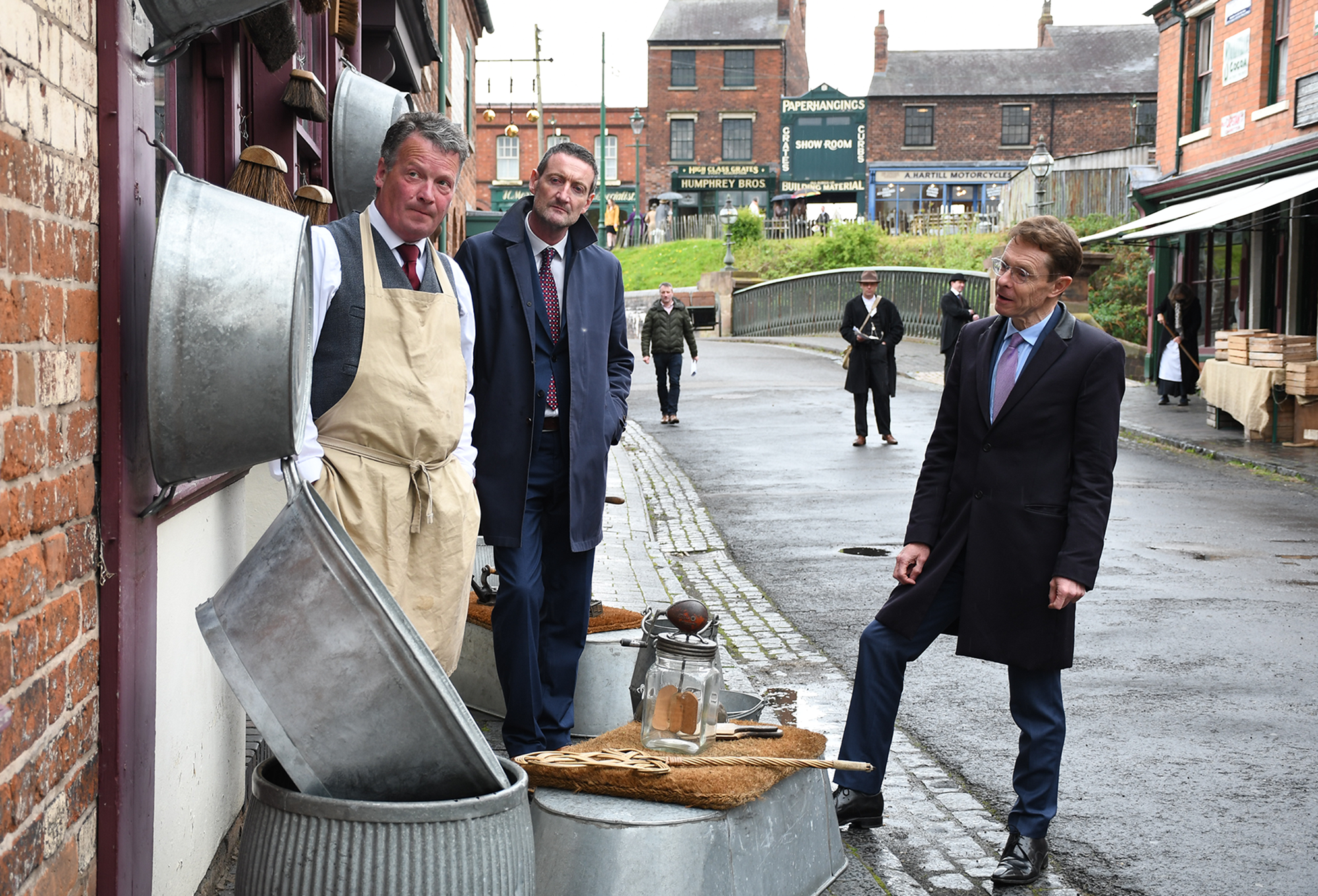 Andy Street, Mayor of the West Midlands (right) and Andrew Lovett (centre) chief executive officer at Black Country Living Museum meet one of the museum's historic characters