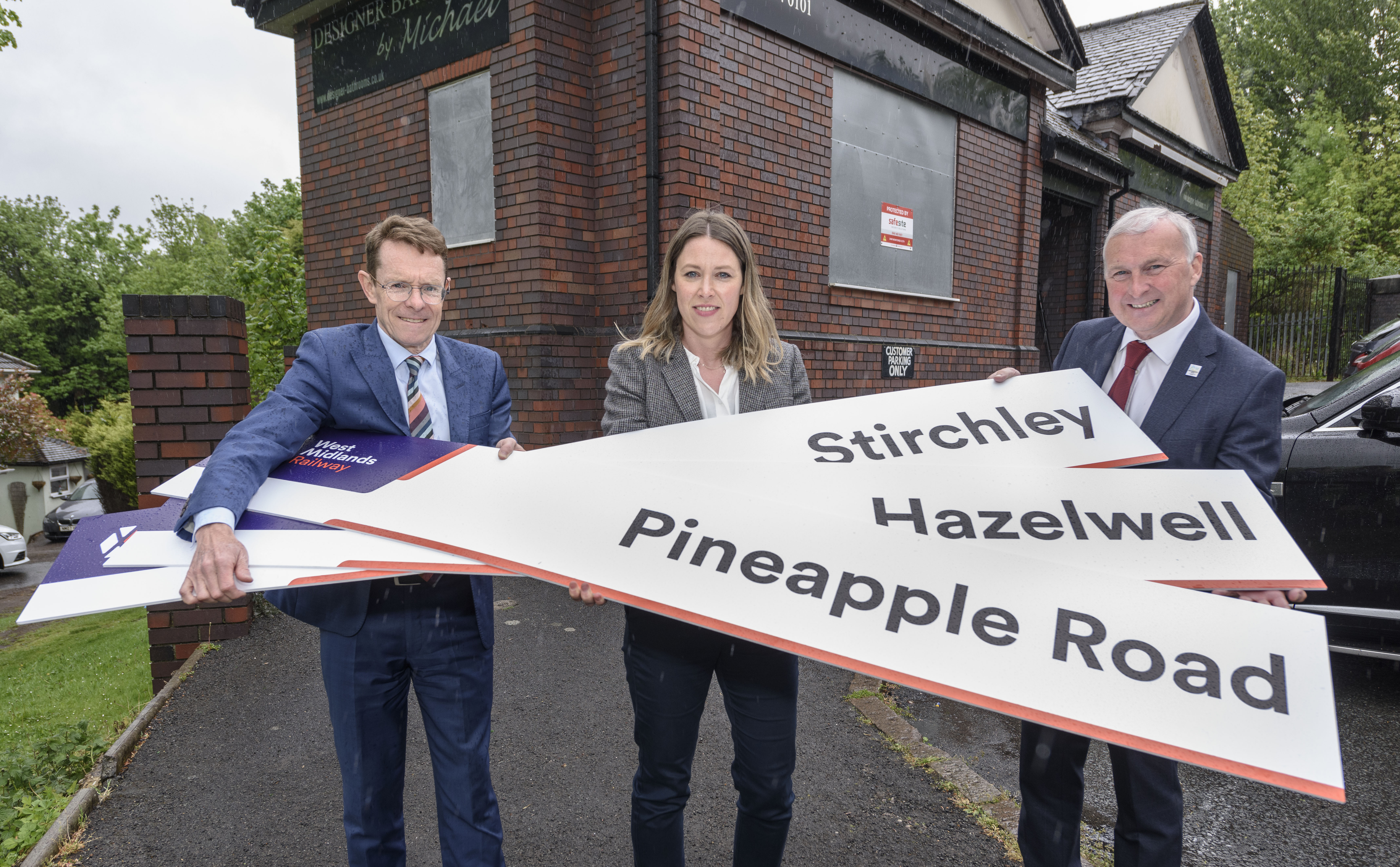 Mayor Andy Street, Kate Trevorrow (WMRE) and Cllr Ian Ward outside the former Hazelwell Station building with the proposed new names