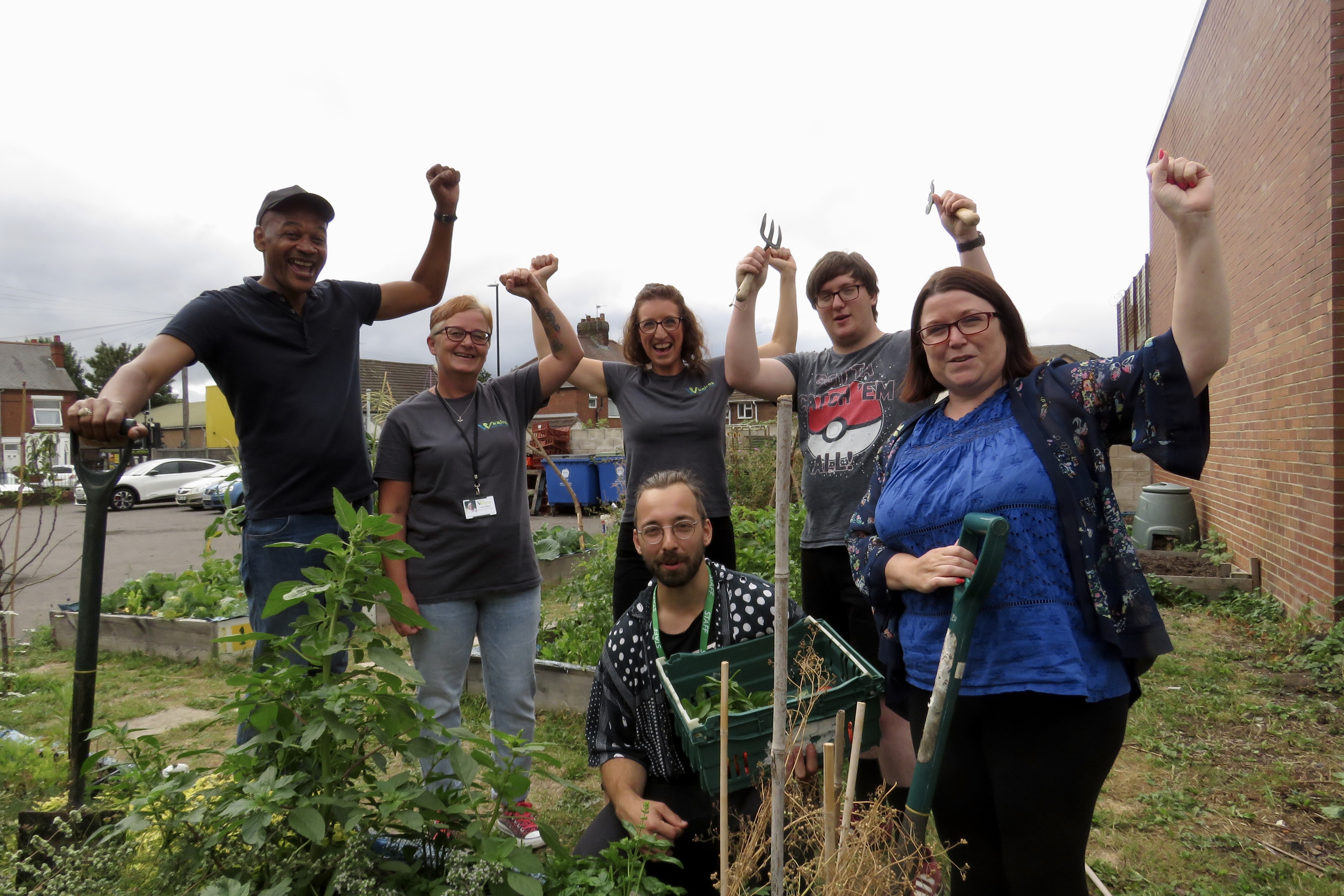 Image (L-R): Simon Harrison, activities co-ordinator at Feeding Coventry; Lisa Miller, support and advocacy practitioner at Kairos – women working together; Hannah Coban, head of service delivery at Kairos; Bradley Robertson, gardening volunteer at Feeding Coventry; Helen Needham, chief executive at Feeding Coventry; front, Jean-Baptiste Vincent, support worker at Feeding Coventry, celebrate the Community Green Grant funding awards.